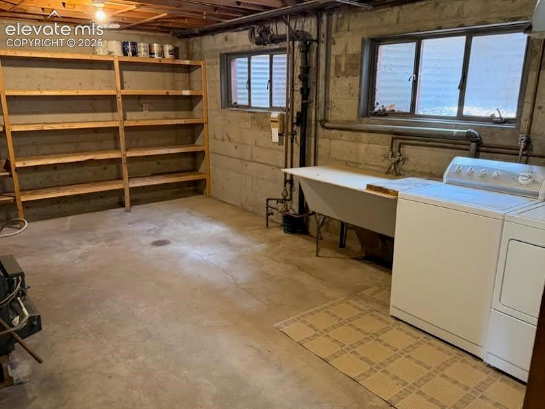 Image 19 of 27: Huge laundry room with sink and lots of storage