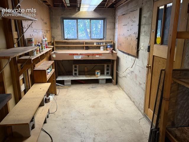 Image 21 of 27: This basement workshop is a handyman