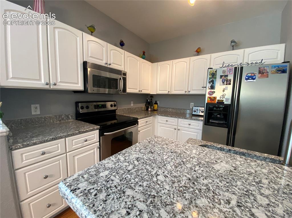 Image 19 of 40: The kitchen provides a bright and functional space