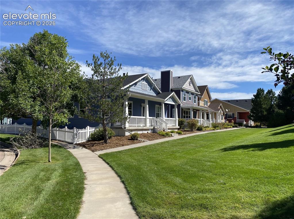 Image 2 of 40: Relax and unwind on the friendly front porch, perfect for evening outdoor l