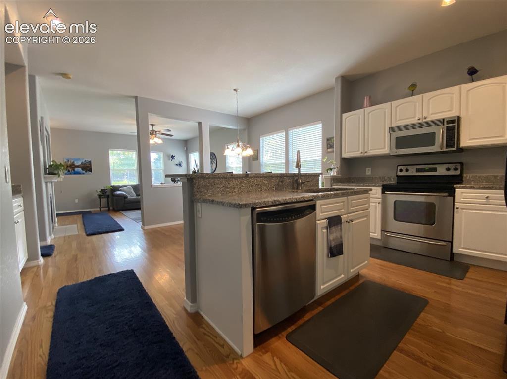 Image 20 of 40: The open layout allows everyone to stay connected without feeling cramped