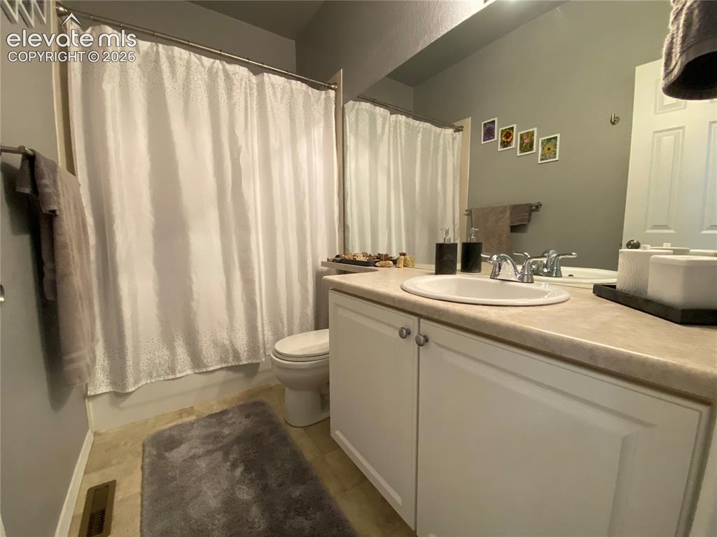 Image 22 of 40: Enjoy a bright and refreshed full gues bathroom with a new sink, contempora
