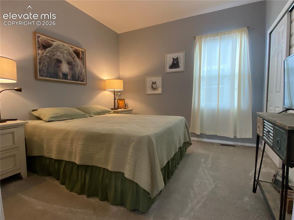Image 23 of 40: This guest-ready second bedroom provides versatile space for family or frie