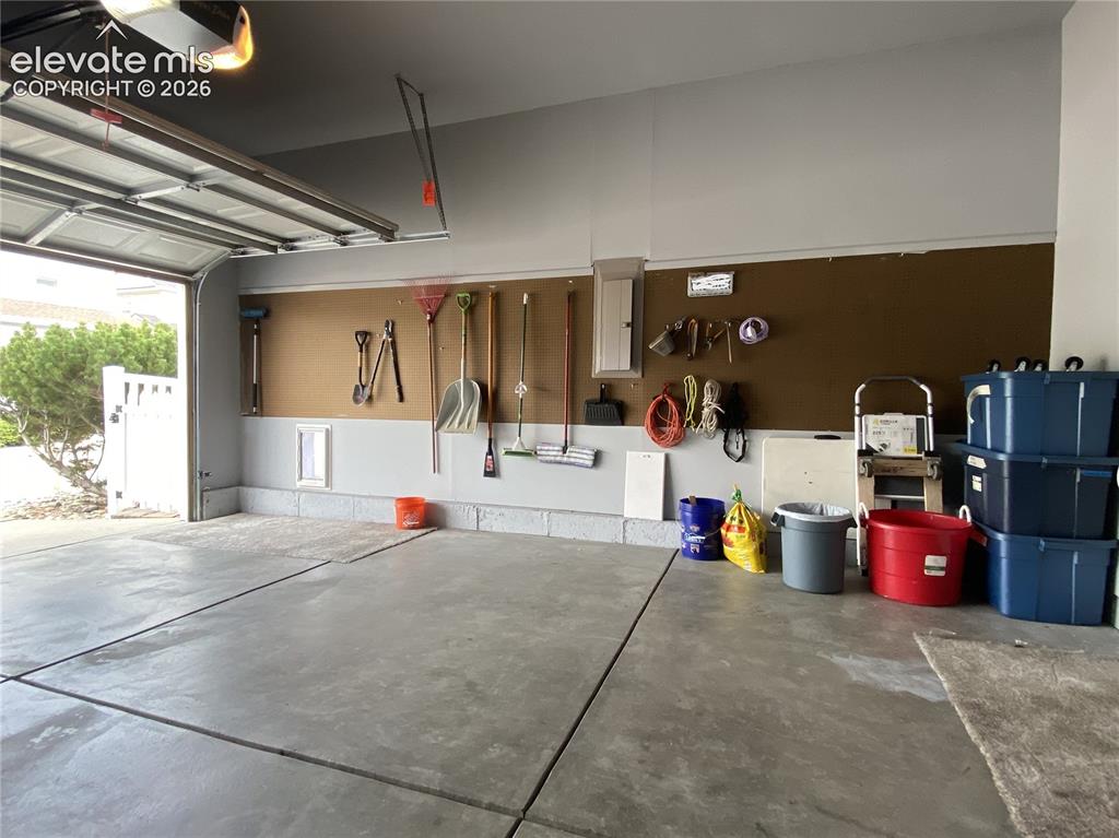 Image 29 of 40: With generous garage storage, there