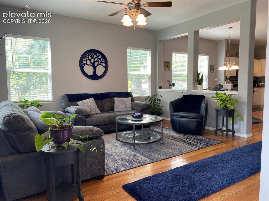 Image 3 of 40: Featuring beutiful natural hardwood floors, this home offers stylish, low-m
