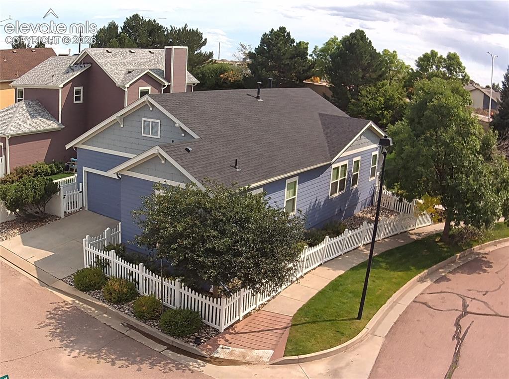 Image 7 of 40: The updated landscaping complements the classic white picket fencing, creat