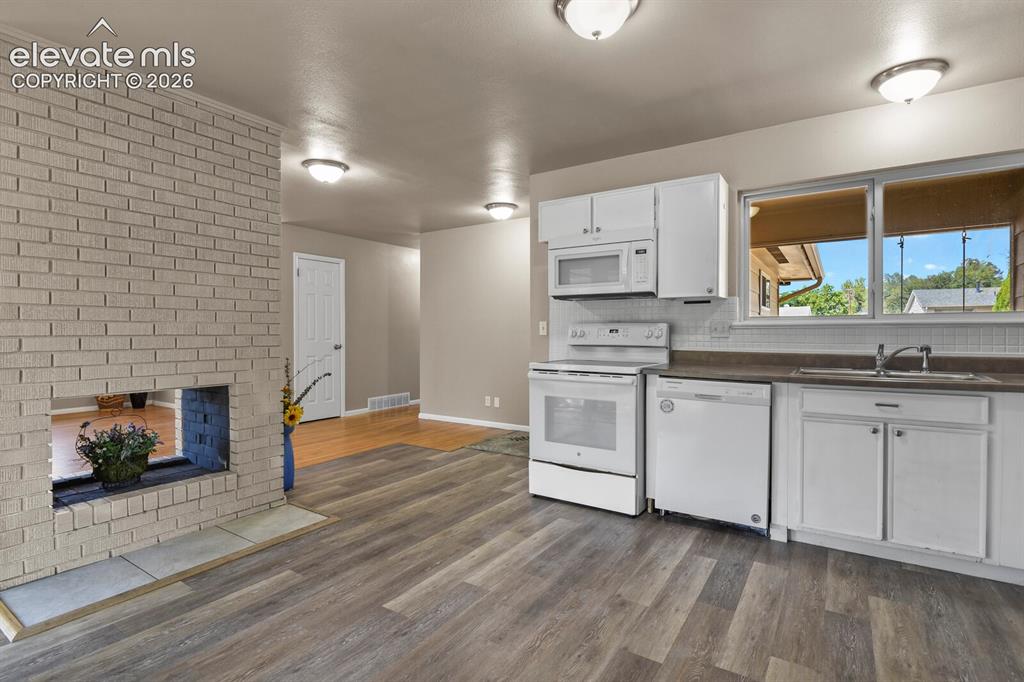Image 10 of 26: with see thru fireplace to living room