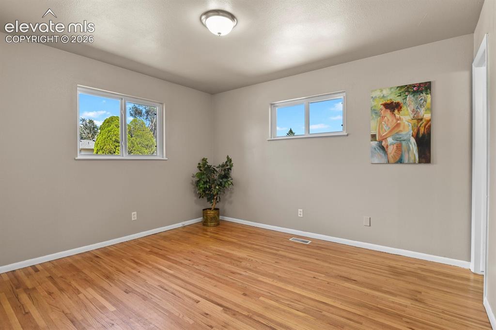 Image 12 of 26: with hardwood flooring