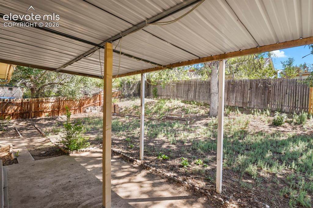 Image 21 of 26: Covered rear patio
