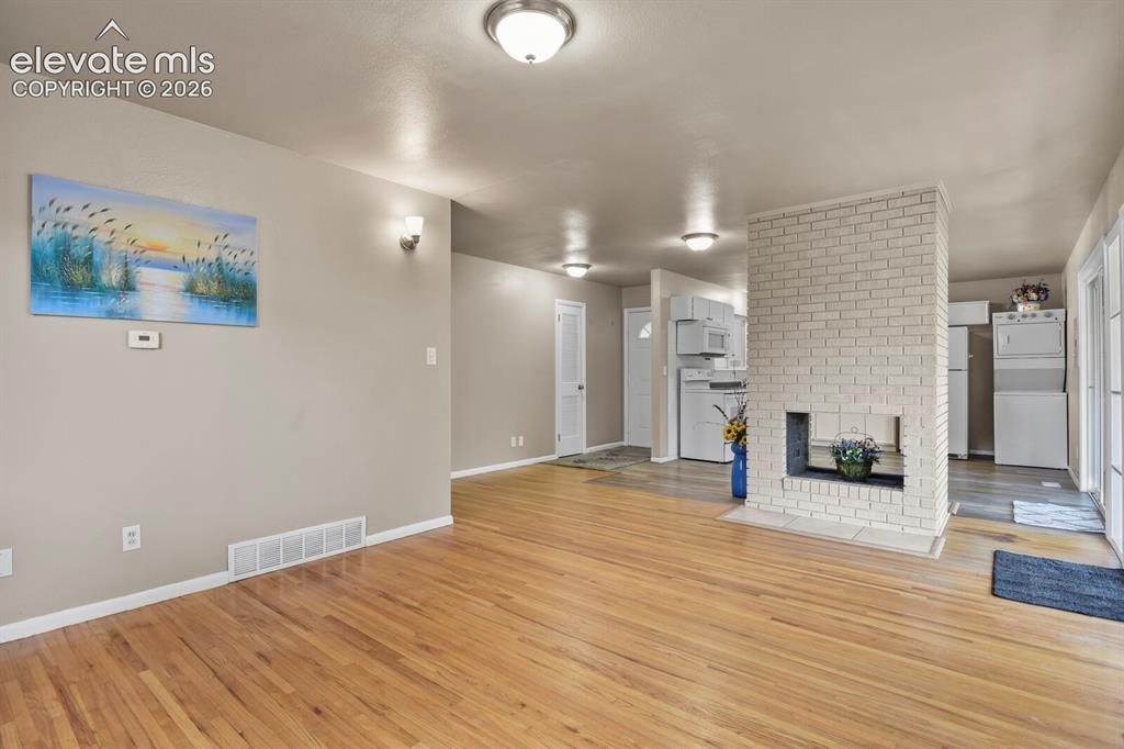 Image 5 of 26: with hardwood flooring 