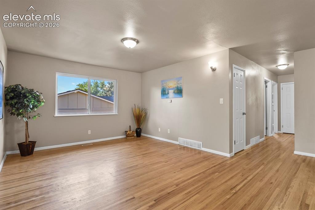 Image 6 of 26: & hallway to bedrooms & baths