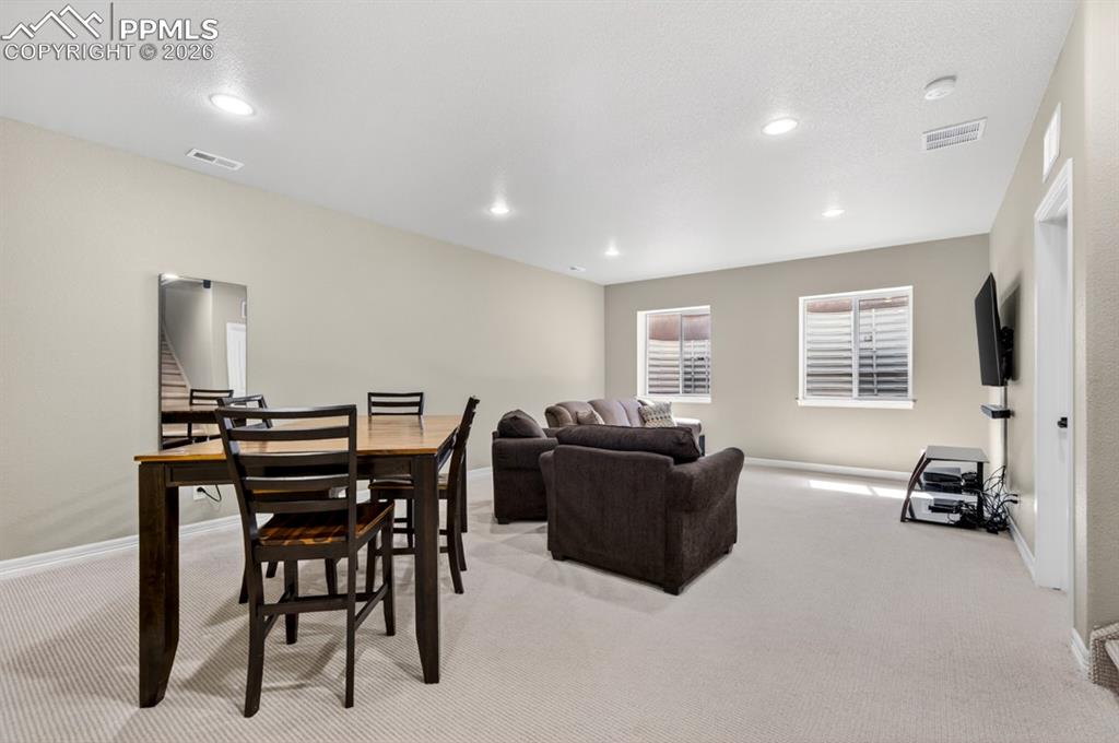 Image 34 of 47: Spacious family room featuring neutral carpeting, recessed ceiling lighting