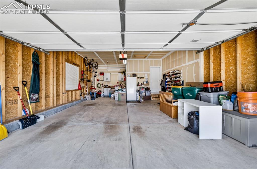Image 42 of 47: Spacious 2 car garage with extra deep bay on the left