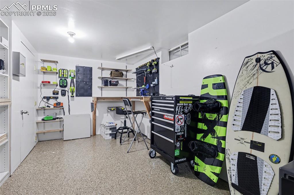 Image 39 of 44: Basement workshop and storage area