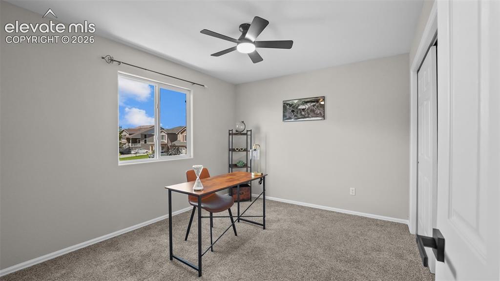 Image 17 of 47: Neutral paint palette, ceiling fan, and carpeted flooring
