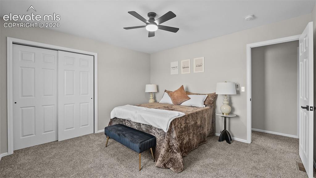 Image 19 of 47: Neutral-toned wall paint, carpet flooring, a ceiling fan with integrated li