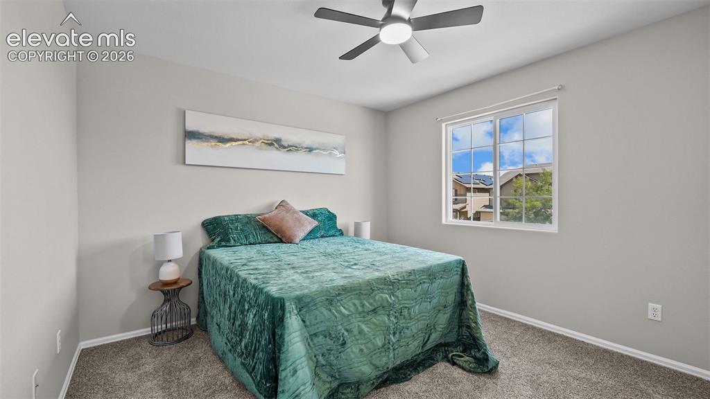 Image 20 of 47: Interior room featuring light gray wall paint, a ceiling fan with integrate