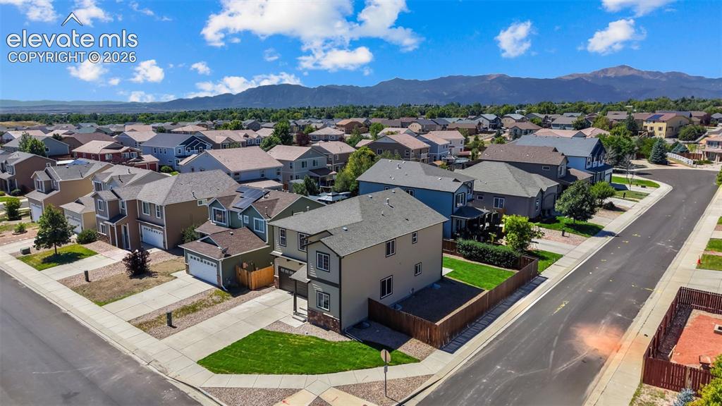Image 39 of 47: Expansive residential community with established homes, paved streets, and