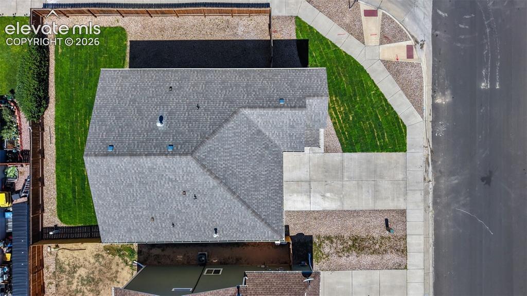 Image 43 of 47: Asphalt shingle roof with multiple dormers, vent pipe, and skylights