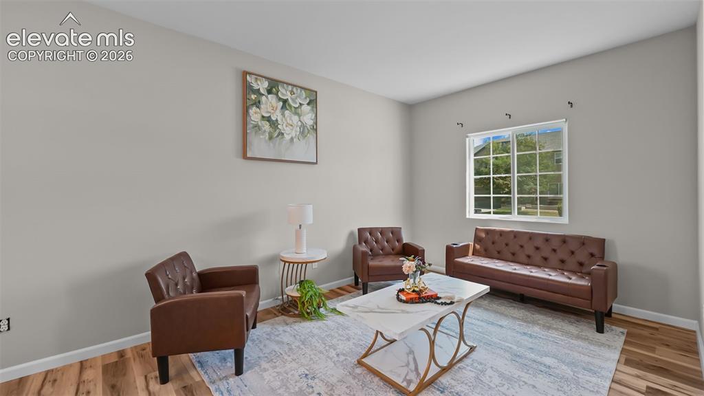 Image 7 of 47: Light-toned wall finishes, recessed lighting, and wood-finish flooring