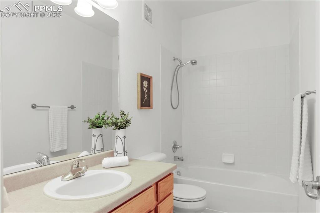 Image 11 of 31: Full bath featuring bathtub / shower combination and vanity