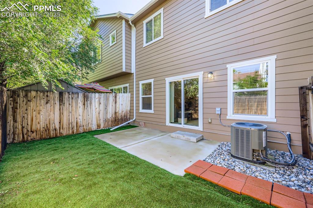 Image 2 of 27: Rear view of property with a patio area