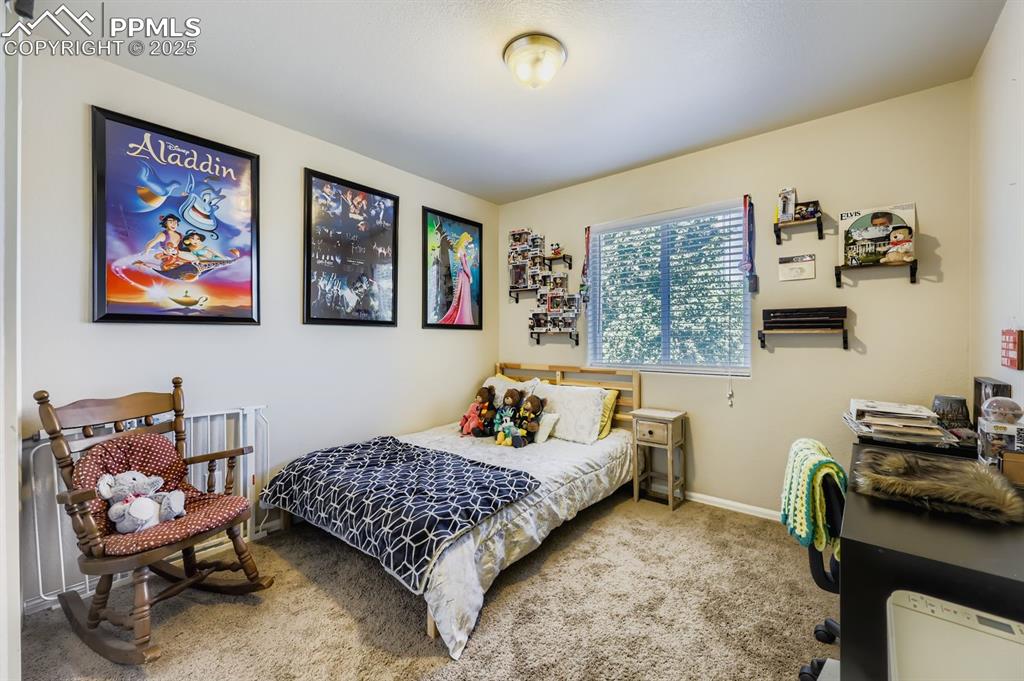 Image 20 of 27: Carpeted bedroom featuring baseboards