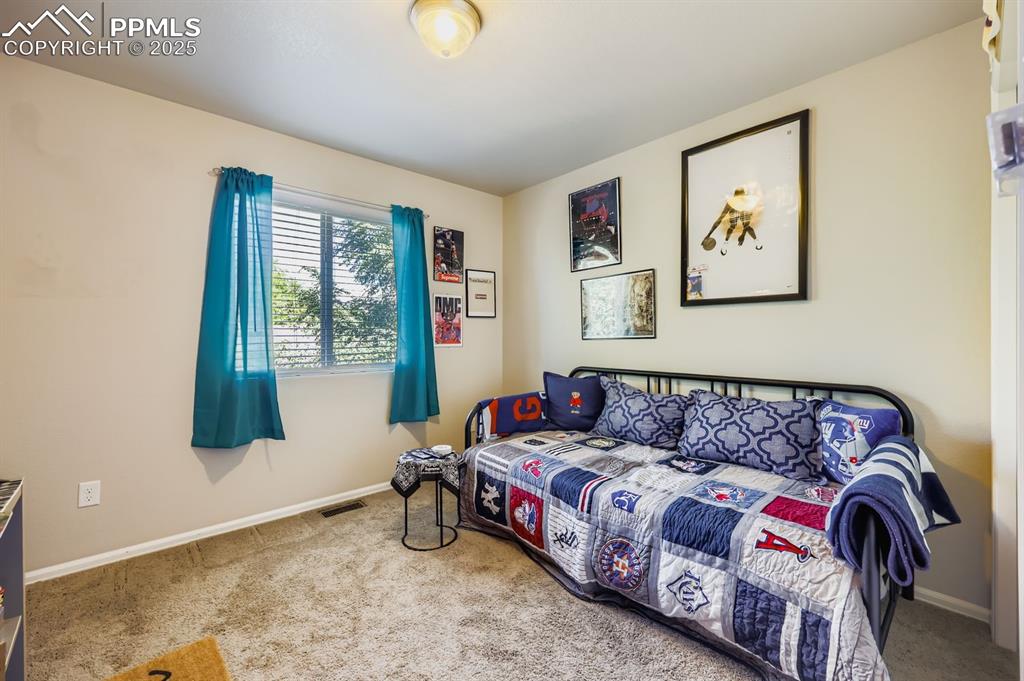 Image 22 of 27: Bedroom with carpet and baseboards