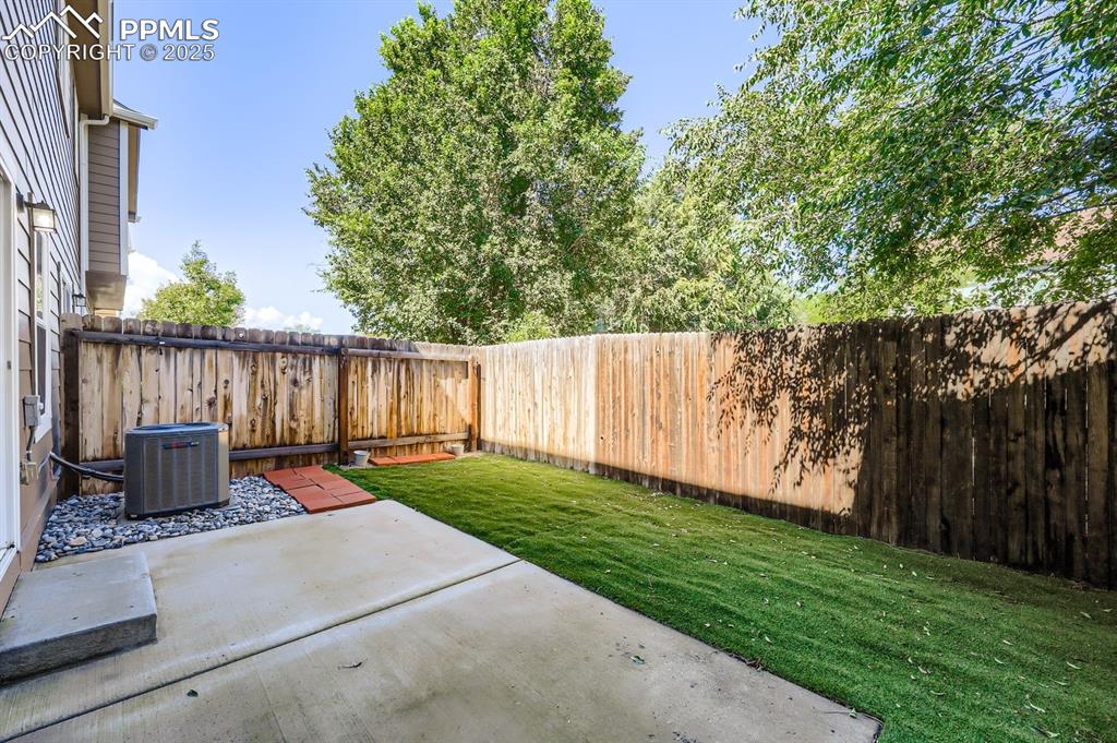 Image 27 of 27: Fenced backyard featuring a patio area