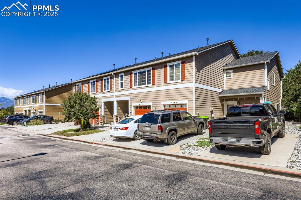 Image 4 of 27: Traditional-style home with roof with shingles