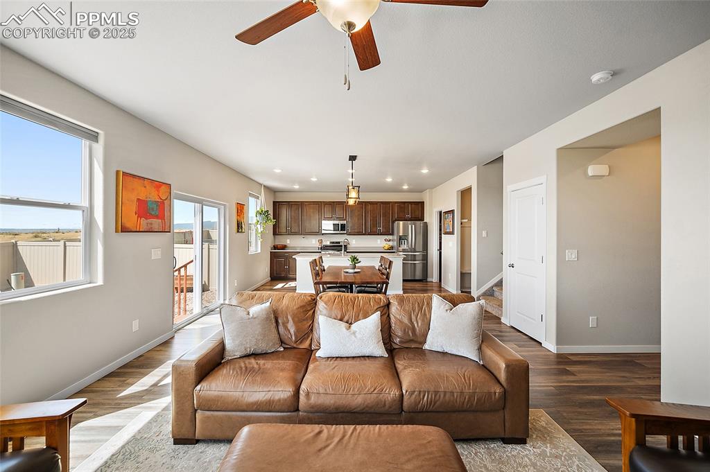 Image 16 of 40: View from front of living room to the kitchen