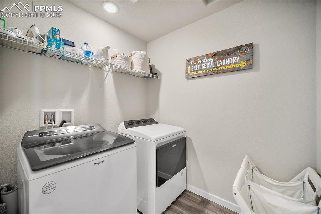 Image 27 of 40: Conveniently located laundry room on upper floor near bedrooms