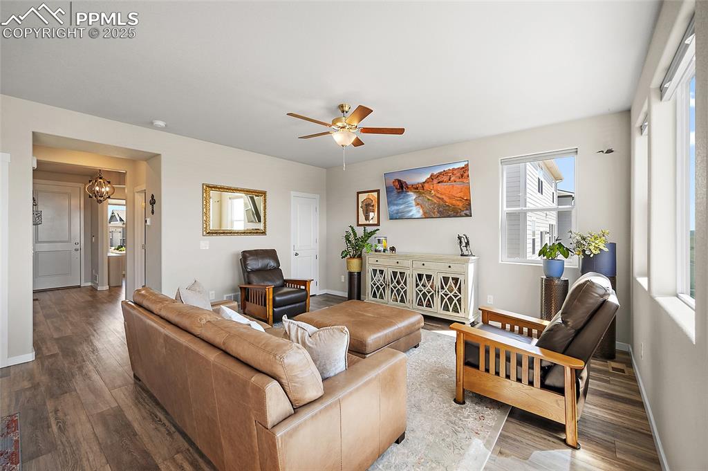 Image 7 of 40: Living room with view from entry and sitting room