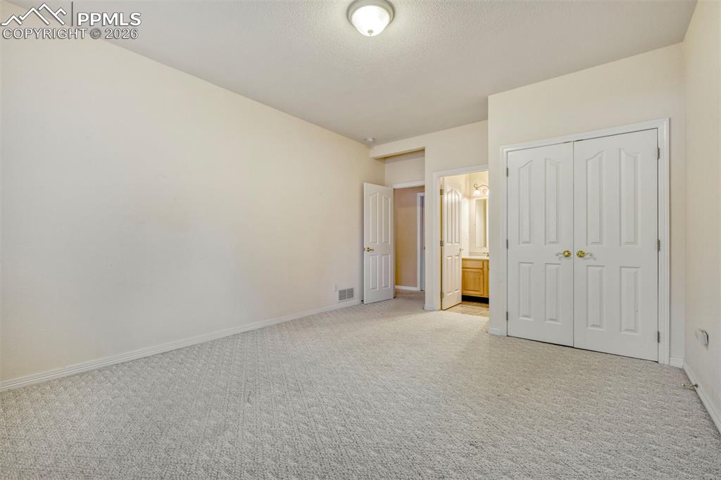 Image 27 of 50: Basement bedroom and ensuite full bath