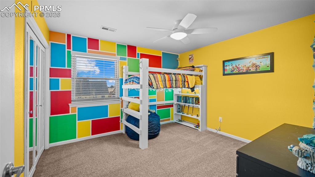 Image 19 of 44: Bedroom featuring light colored carpet and ceiling fan