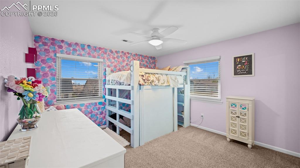 Image 21 of 44: Bedroom featuring light colored carpet and a ceiling fan