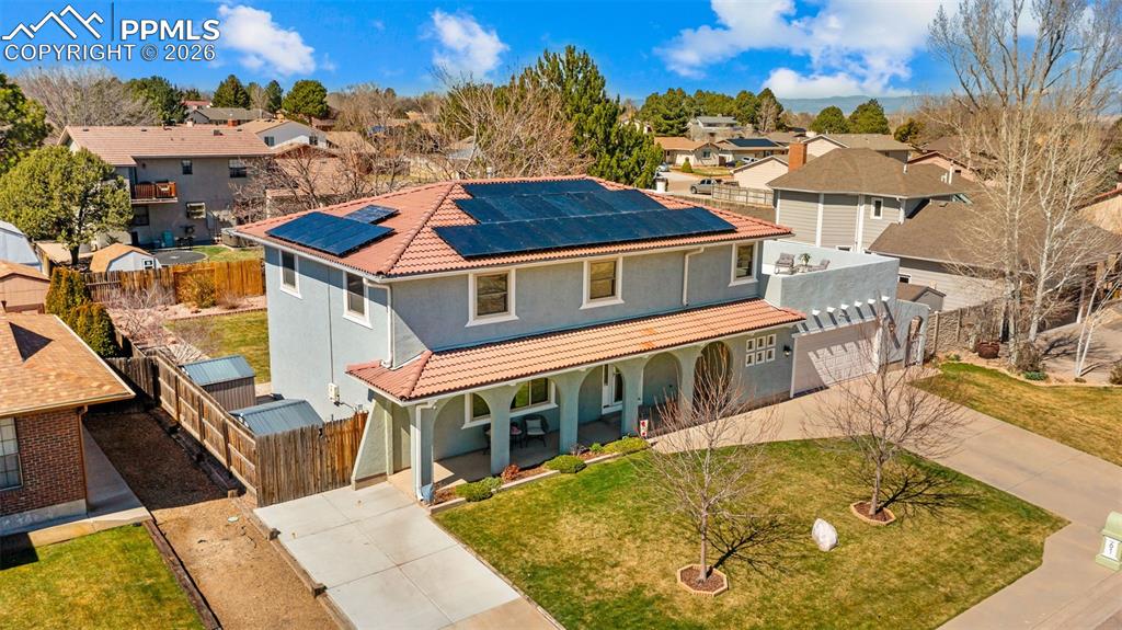 Image 33 of 44: Mediterranean / spanish house featuring driveway, a tile roof, roof mounted