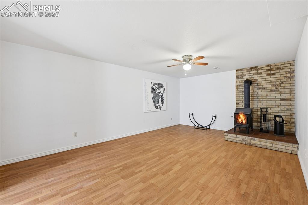 Image 18 of 32: Large rec room area in basement