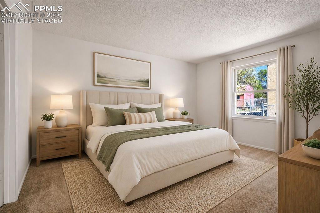 Image 19 of 50: Virtually Staged - This bedroom features light-colored walls and carpeting,