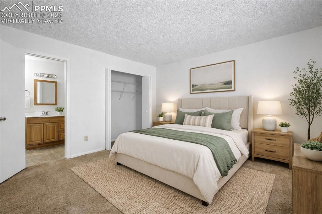 Image 21 of 50: Virtually Staged - This inviting room features soft carpeting, a convenient