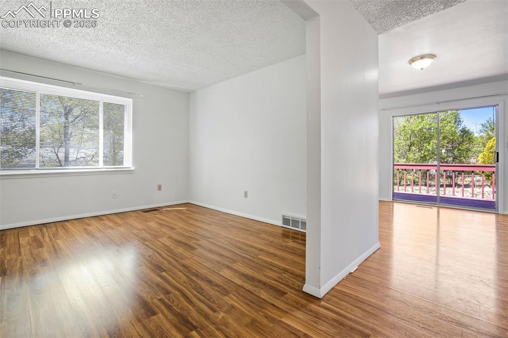 Image 8 of 50: The property features hard flooring, a large window providing natural light