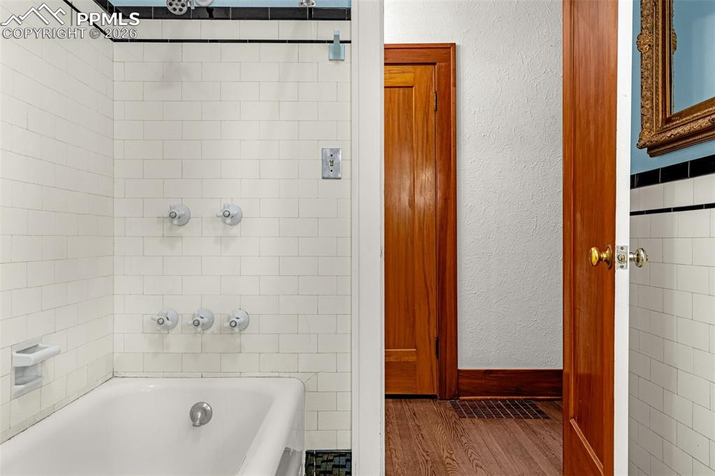 Image 36 of 50: Main level hall bath