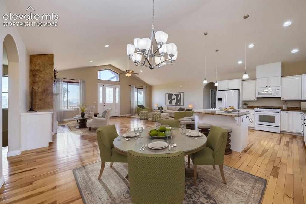 Image 13 of 47: This kitchen features a large dining area with easy access to both the back