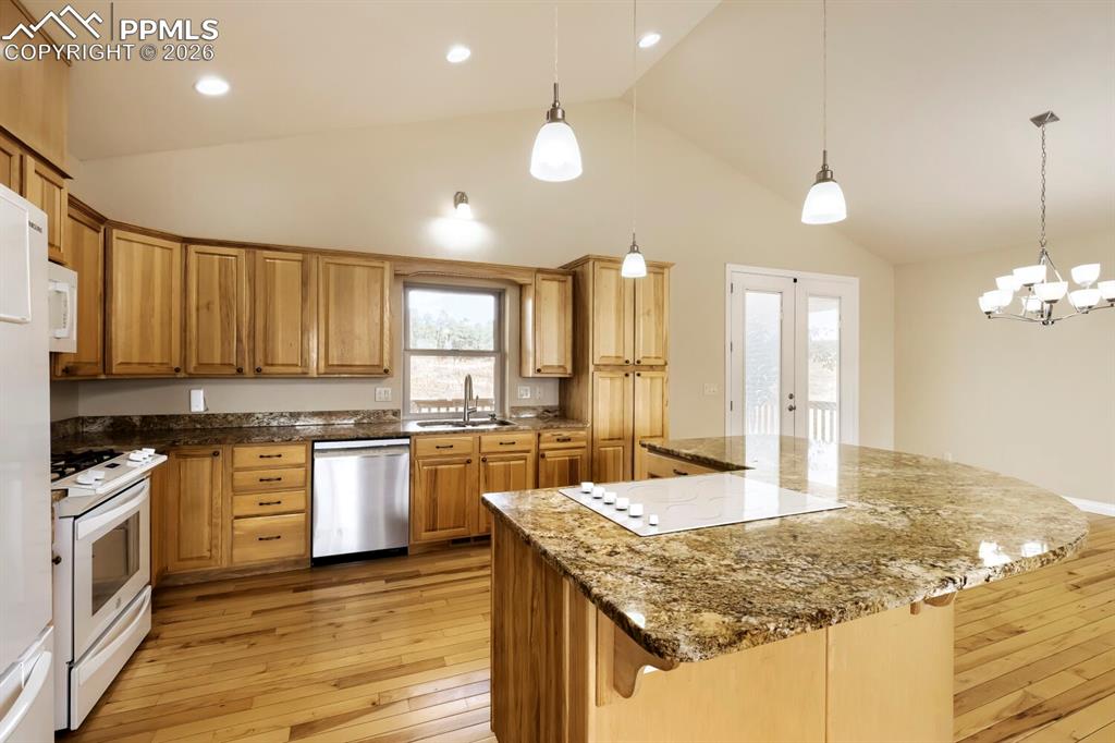 Image 14 of 48: The property includes two refrigerators: one in the kitchen and one in the