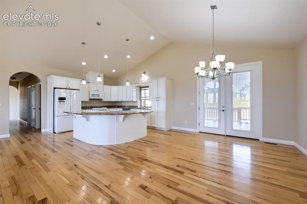 Image 14 of 47: Observe the arch leading you to two additional bedrooms. large laudndry roo