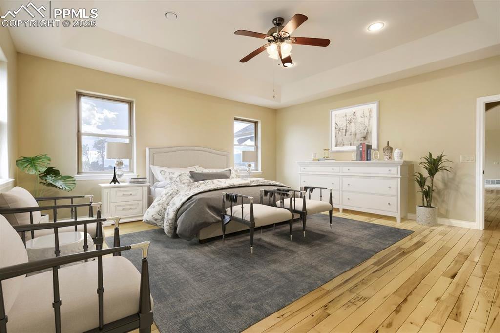 Image 21 of 48: This spacious primary bedroom boasts stunning Pikes Peak views, a huge walk