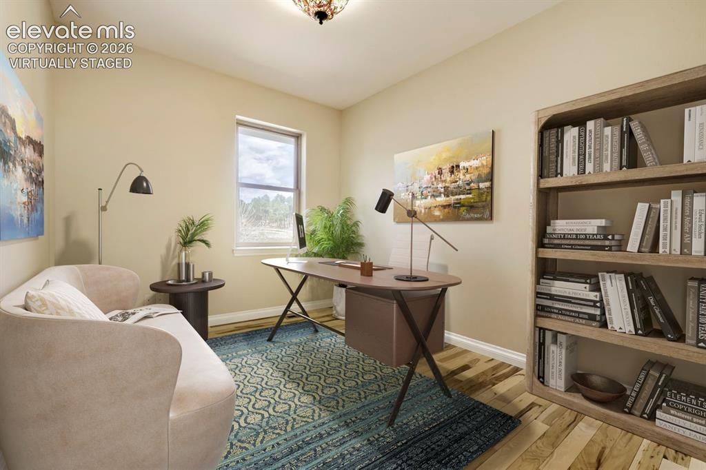 Image 25 of 47: Virtually Staged. This large office rests beside the master bedroom.