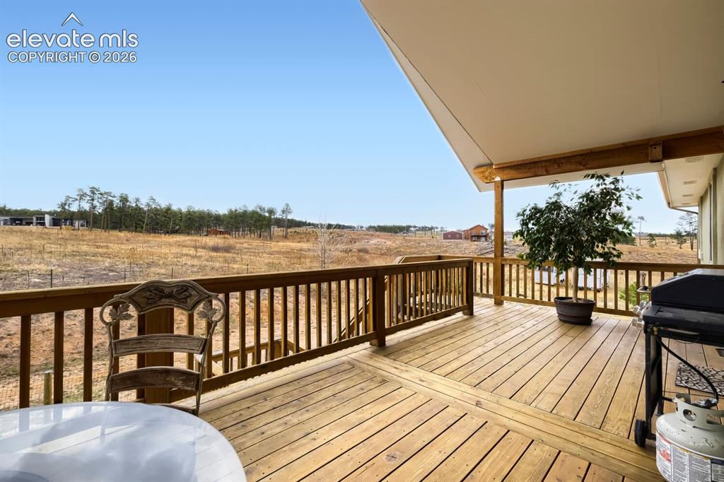 Image 32 of 47: The covered back deck offers more private dining and entertainment opportun