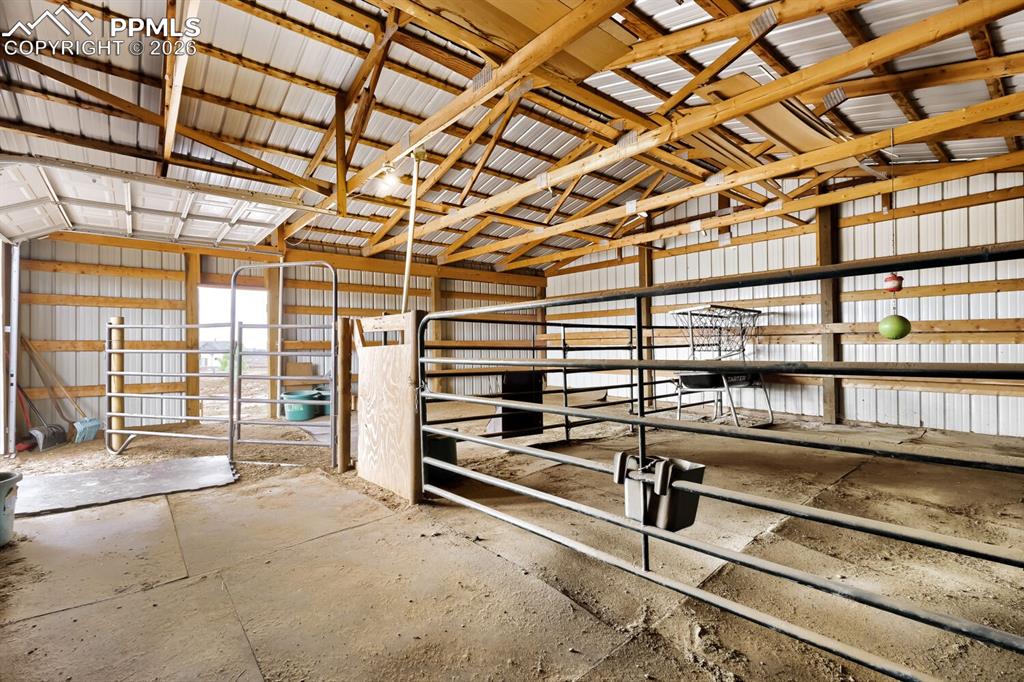 Image 39 of 48: Large enclosed barn equipped with two stalls and the opportunity to add mor
