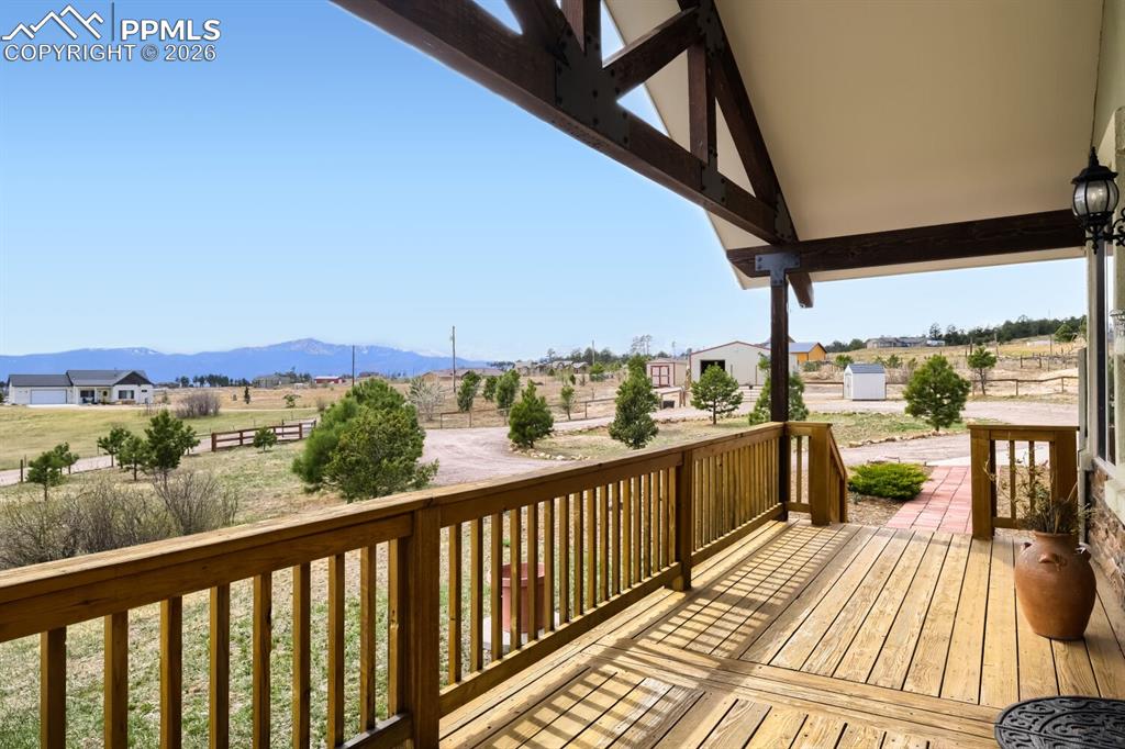 Image 6 of 48: Front Porch- This spacious entry welcomes you with a large covered patio an
